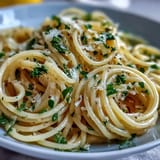 Easy lemon butter pasta recipe featuring al dente spaghetti tossed in zesty lemon-garlic butter sauce.  