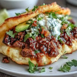 Savory taco meat piled high on airy cloud bread shells, ready to enjoy.