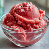 Frozen watermelon sorbet (3 ingredients) glistening, perfect for a refreshing summer treat.