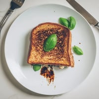 Golden, crispy sourdough holds roasted zucchini, peppers, melted mozzarella, and fresh tomato slices in a vibrant Roasted Veggie Caprese Grilled Cheese.